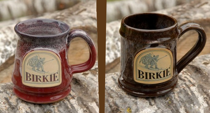 one red birkie mugs and one brown birkie mug 